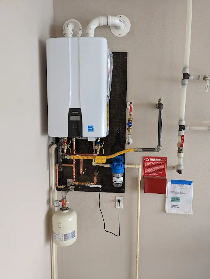 Professional plumber installing copper piping in a Immokalee home